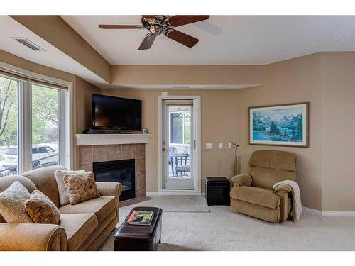 1117-48 Inverness Gate Se, Calgary, AB - Indoor Photo Showing Living Room With Fireplace