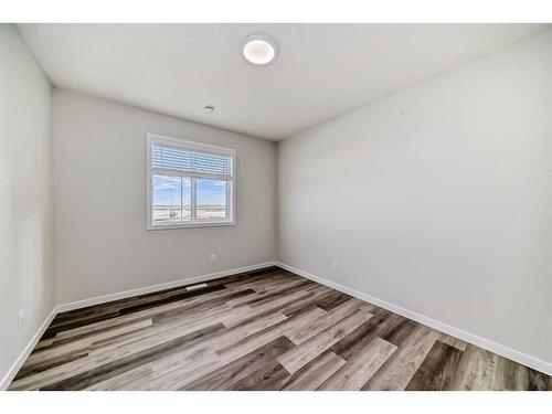 72 Magnolia Bay Se, Calgary, AB - Indoor Photo Showing Other Room