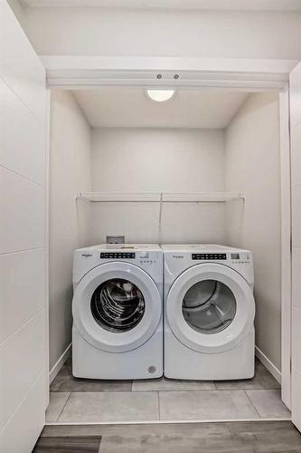 72 Magnolia Bay Se, Calgary, AB - Indoor Photo Showing Laundry Room