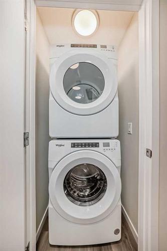 72 Magnolia Bay Se, Calgary, AB - Indoor Photo Showing Laundry Room