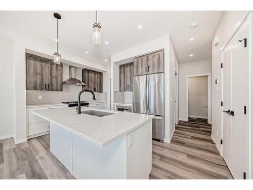 72 Magnolia Bay Se, Calgary, AB - Indoor Photo Showing Kitchen With Stainless Steel Kitchen With Double Sink With Upgraded Kitchen