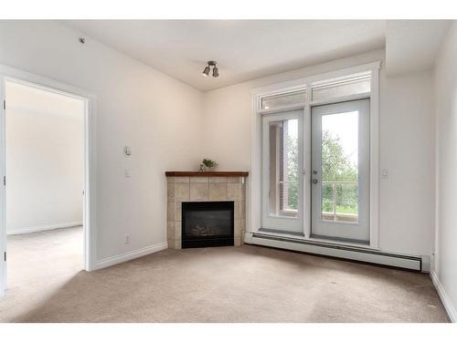 3316-24 Hemlock Crescent Sw, Calgary, AB - Indoor Photo Showing Other Room With Fireplace