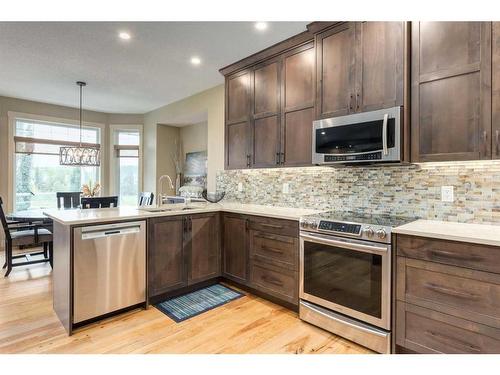 139 West Terrace Point, Cochrane, AB - Indoor Photo Showing Kitchen With Upgraded Kitchen