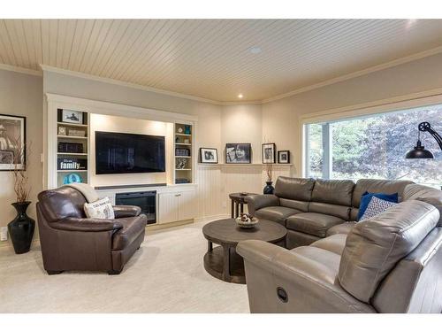 139 West Terrace Point, Cochrane, AB - Indoor Photo Showing Living Room With Fireplace