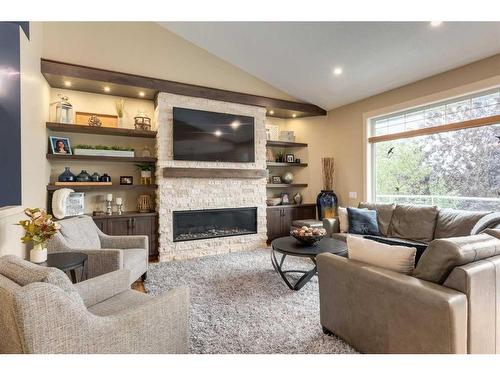 139 West Terrace Point, Cochrane, AB - Indoor Photo Showing Living Room With Fireplace