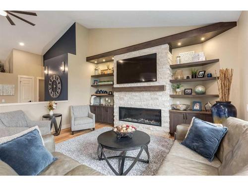 139 West Terrace Point, Cochrane, AB - Indoor Photo Showing Living Room With Fireplace