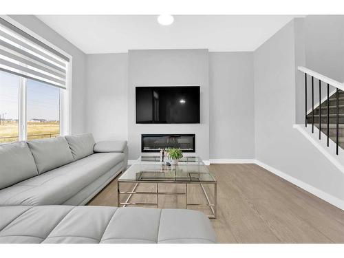 114 Waterford Road, Chestermere, AB - Indoor Photo Showing Living Room With Fireplace