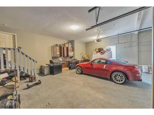 177 Stonemere Close, Chestermere, AB - Indoor Photo Showing Garage