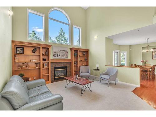 2 Canso Court Sw, Calgary, AB - Indoor Photo Showing Living Room With Fireplace