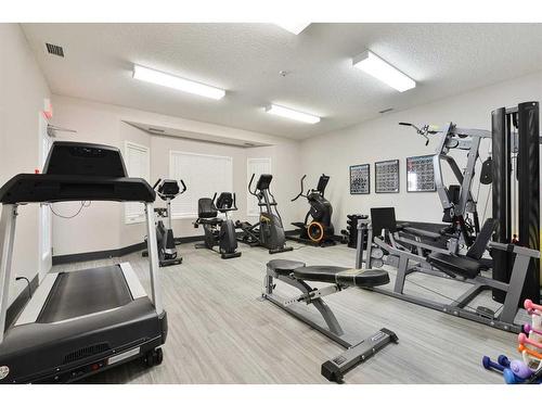 1112-1112 Sienna Park Green Sw, Calgary, AB - Indoor Photo Showing Gym Room