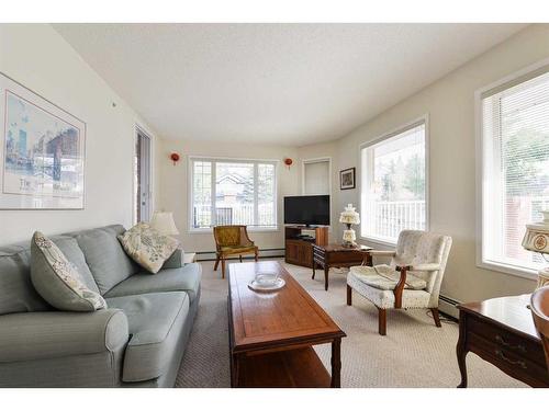 1112-1112 Sienna Park Green Sw, Calgary, AB - Indoor Photo Showing Living Room