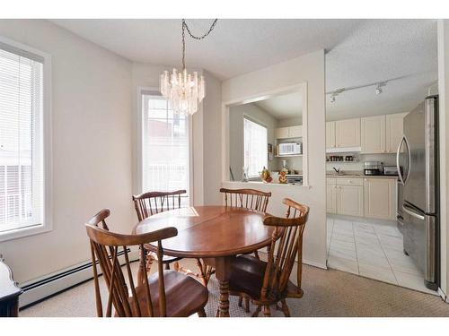 1112-1112 Sienna Park Green Sw, Calgary, AB - Indoor Photo Showing Dining Room