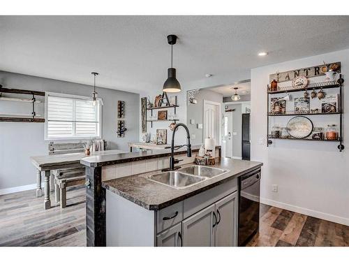 11 Bridlecrest Road Sw, Calgary, AB - Indoor Photo Showing Kitchen With Double Sink