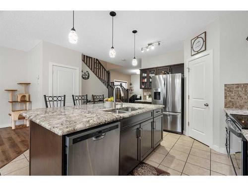 1031 Kings Heights Road, Airdrie, AB - Indoor Photo Showing Kitchen With Double Sink With Upgraded Kitchen