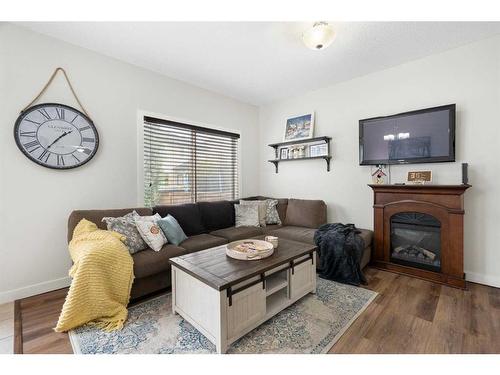 1031 Kings Heights Road, Airdrie, AB - Indoor Photo Showing Living Room With Fireplace