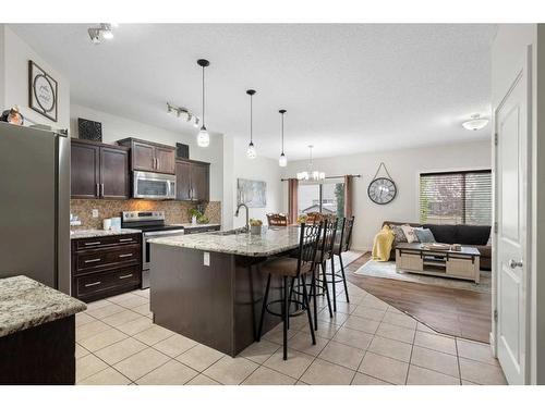 1031 Kings Heights Road, Airdrie, AB - Indoor Photo Showing Kitchen With Upgraded Kitchen