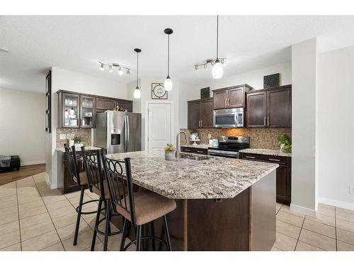 1031 Kings Heights Road, Airdrie, AB - Indoor Photo Showing Kitchen With Upgraded Kitchen