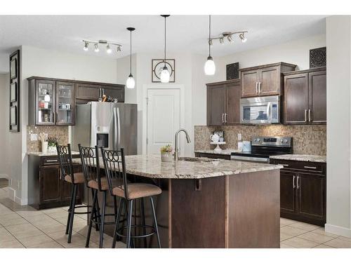 1031 Kings Heights Road, Airdrie, AB - Indoor Photo Showing Kitchen With Upgraded Kitchen