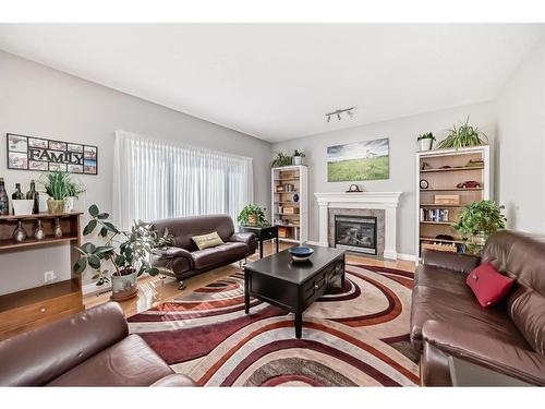 316 Springmere Way, Chestermere, AB - Indoor Photo Showing Living Room With Fireplace