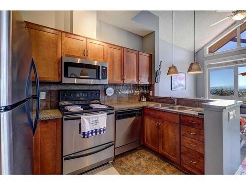 19-153 Rockyledge View Nw, Calgary, AB - Indoor Photo Showing Kitchen With Double Sink