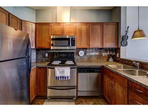 19-153 Rockyledge View Nw, Calgary, AB - Indoor Photo Showing Kitchen With Double Sink