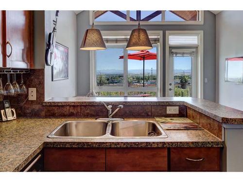 19-153 Rockyledge View Nw, Calgary, AB - Indoor Photo Showing Kitchen With Double Sink