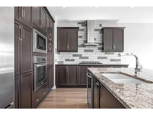 28 Sunset Manor, Cochrane, AB - Indoor Photo Showing Kitchen With Double Sink