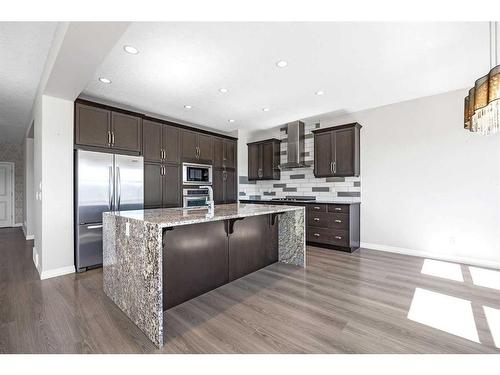 28 Sunset Manor, Cochrane, AB - Indoor Photo Showing Kitchen With Upgraded Kitchen