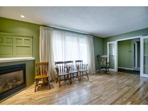 3235 Oakwood Drive Sw, Calgary, AB - Indoor With Fireplace