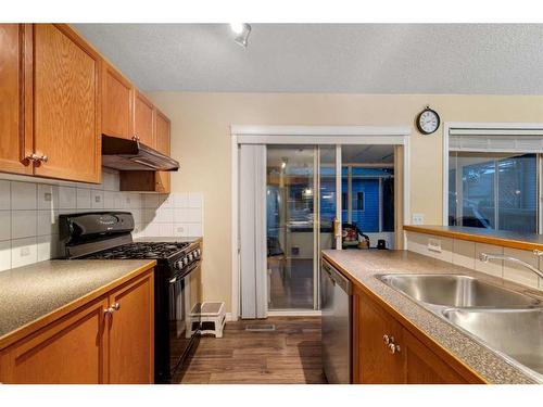 552 Prestwick Circle Se, Calgary, AB - Indoor Photo Showing Kitchen With Double Sink