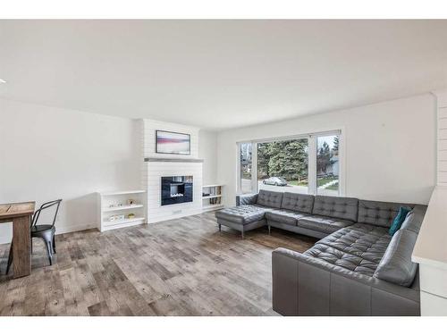 1164 Lake Wapta Road Se, Calgary, AB - Indoor Photo Showing Living Room With Fireplace