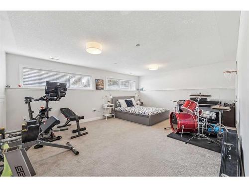 1164 Lake Wapta Road Se, Calgary, AB - Indoor Photo Showing Gym Room