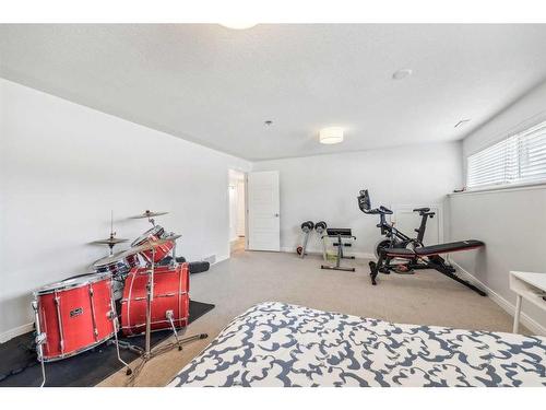 1164 Lake Wapta Road Se, Calgary, AB - Indoor Photo Showing Gym Room