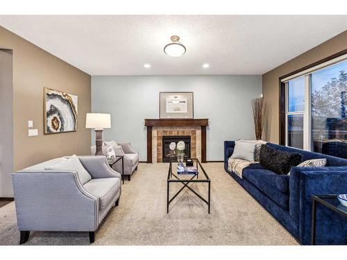 9 Pantego Link Nw, Calgary, AB - Indoor Photo Showing Living Room With Fireplace