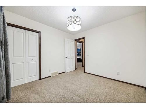 9 Pantego Link Nw, Calgary, AB - Indoor Photo Showing Other Room