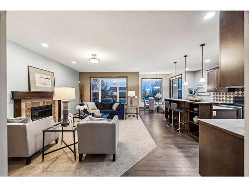 9 Pantego Link Nw, Calgary, AB - Indoor With Fireplace