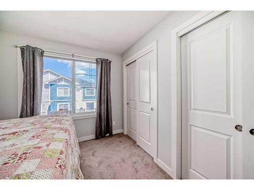 2409 Jumping Pound Common, Cochrane, AB - Indoor Photo Showing Bedroom