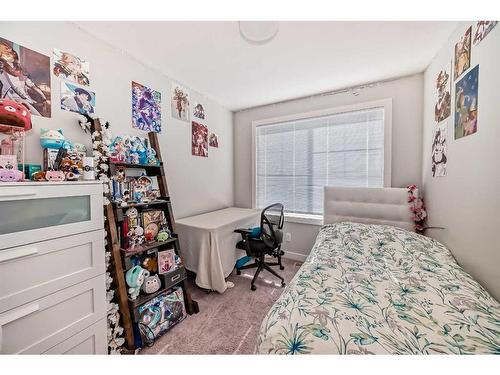 2409 Jumping Pound Common, Cochrane, AB - Indoor Photo Showing Bedroom