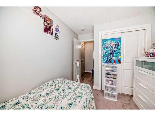 2409 Jumping Pound Common, Cochrane, AB - Indoor Photo Showing Bedroom