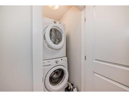 2409 Jumping Pound Common, Cochrane, AB - Indoor Photo Showing Laundry Room