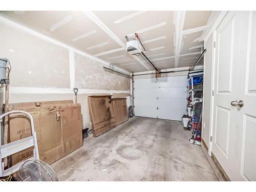 2409 Jumping Pound Common, Cochrane, AB - Indoor Photo Showing Garage