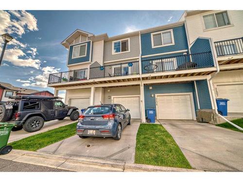 2409 Jumping Pound Common, Cochrane, AB - Outdoor With Balcony With Facade