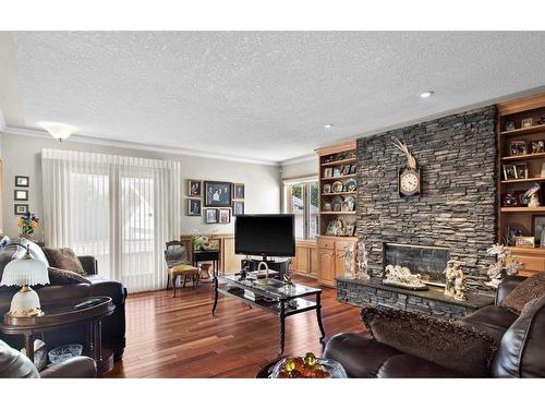 1612 48 Avenue Sw, Calgary, AB - Indoor Photo Showing Living Room With Fireplace