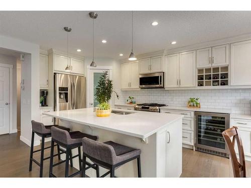 231 Tuscany Ridge View Nw, Calgary, AB - Indoor Photo Showing Kitchen With Double Sink With Upgraded Kitchen