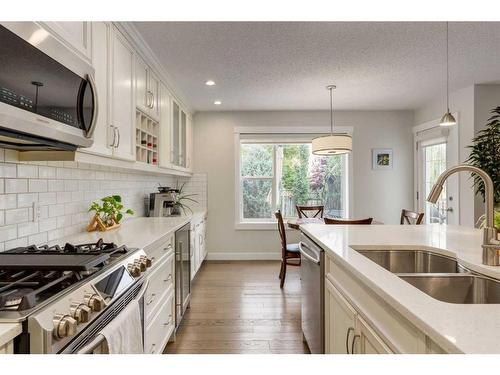 231 Tuscany Ridge View Nw, Calgary, AB - Indoor Photo Showing Kitchen With Double Sink With Upgraded Kitchen