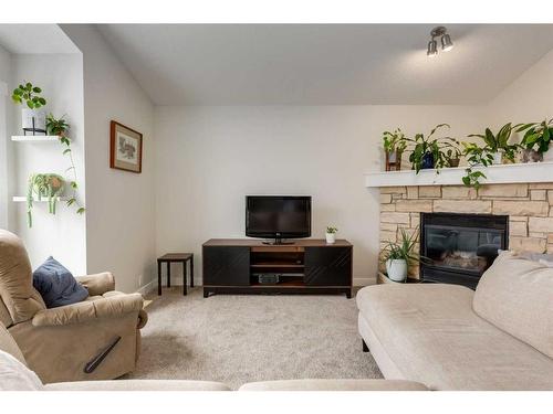 231 Tuscany Ridge View Nw, Calgary, AB - Indoor Photo Showing Living Room With Fireplace