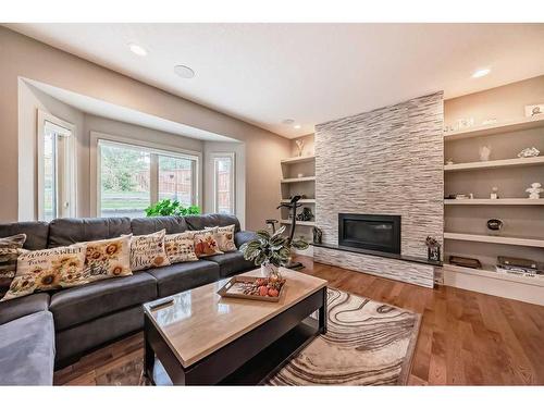 5039 Norris Road Nw, Calgary, AB - Indoor Photo Showing Living Room With Fireplace