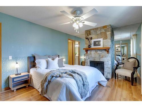 9308 26 Street Sw, Calgary, AB - Indoor Photo Showing Bedroom With Fireplace