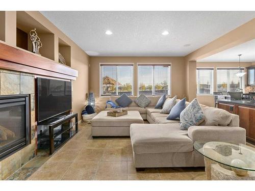 310 Evanspark Circle Nw, Calgary, AB - Indoor Photo Showing Living Room With Fireplace