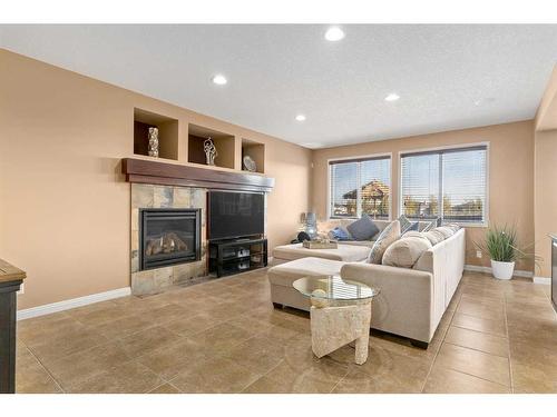 310 Evanspark Circle Nw, Calgary, AB - Indoor Photo Showing Living Room With Fireplace